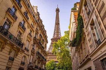 Fotobehang Eiffeltoren Beautiful view to the Eiffel Tower in Paris between the typical mansions - travel photography in Paris France
