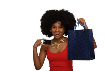 a woman with a shopping bag holds a black credit card and smiles,