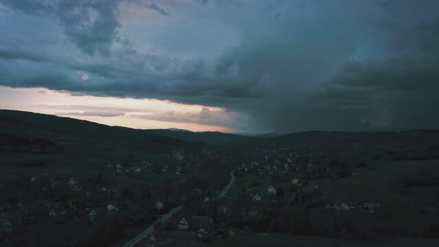 Aerial drone footage of lighting storm, thunderstorm over a countryside. Cinematic landscape weather video. Evening. Nature background. Dark clouds and lightning strikes.