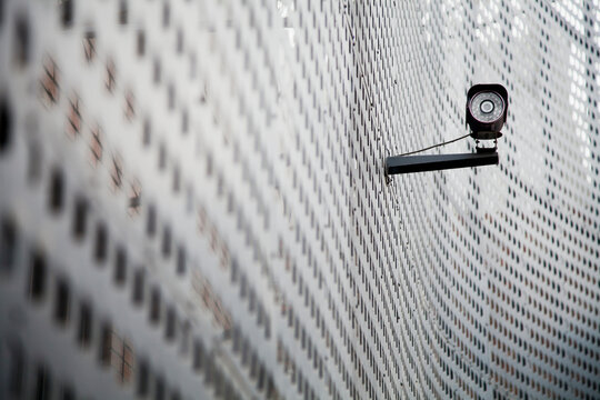 Security camera on curving metal wall; Beijing china