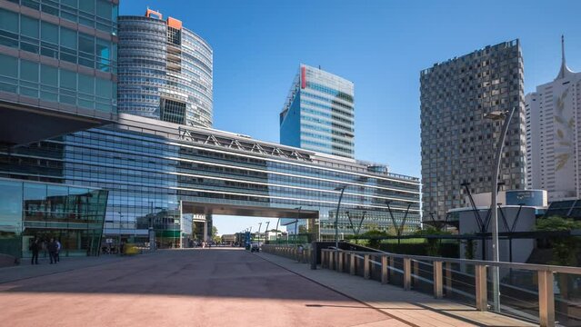 Vienna Donaustadt Danube City timelapse hyperlapse is a modern quarter with skyscrapers and business centres in Vienna, Austria. Modern towers and architecture in vienna city austria