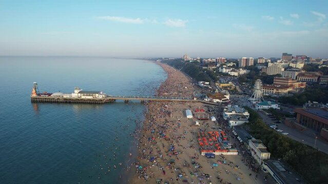 Aerial View Of Many People Are Enjoying Hot Summer Day Of England At Bournemouth Sandy Beach During Their Holidays. Tourist Attraction Captured With Drone's Camera On Sep 9th, 2023, England UK