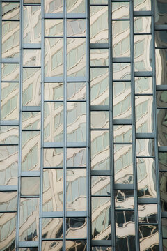 Close Up Of A Gold Glass Building Reflecting Another Building; Toronto Ontario Canada