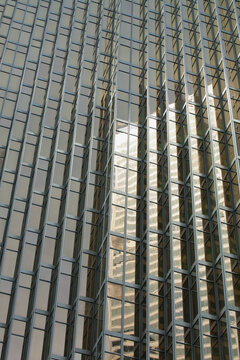 Close up of a gold glass building reflecting another building; Toronto ontario canada