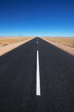 White line on a paved road in the desert; Garub namibia
