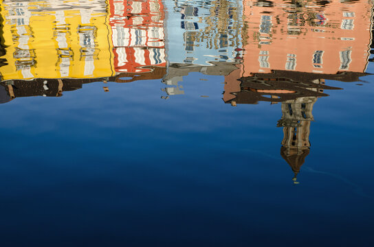 Reflection Of Colourful Buildings In Lake Maggiore; Ascona, Ticino, Switzerland