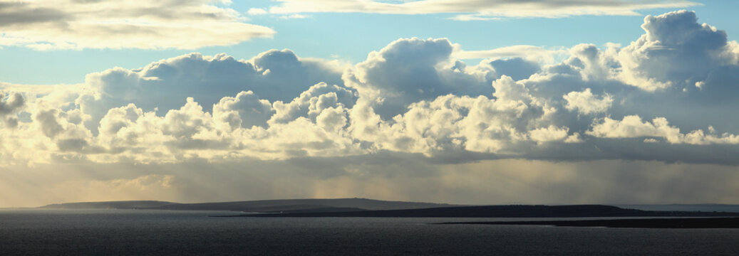 View Of Aran Islands From Cliffs Of Moher With A Dramatic Cloud Formation; County Clare, Ireland