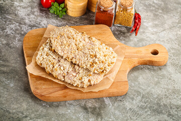 Breaded raw breaded meat schnitzel