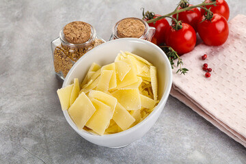 Sliced parmesan cheese in the bowl