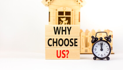 Why choose us symbol. Concept word Why choose us on beautiful wooden block. Black alarm clock....