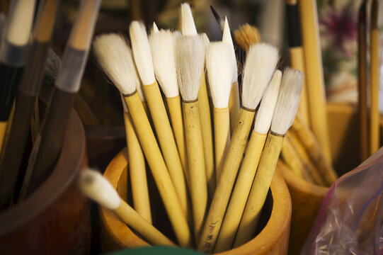 Natural Bristle Artist Brushes In A Wooden Container For Chinese Calligraphy; Gaithersburg, Maryland, United States Of America