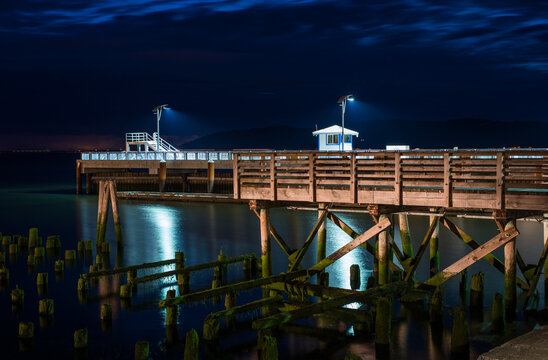 17th Street Pier Is Illuminated On A Summer Evening; Astoria, Oregon, United States Of America