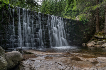 Dziki Waterfall in Karkonosze mountain range in Polish Sudeten Mountains