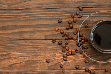 coffee and grains on wooden background