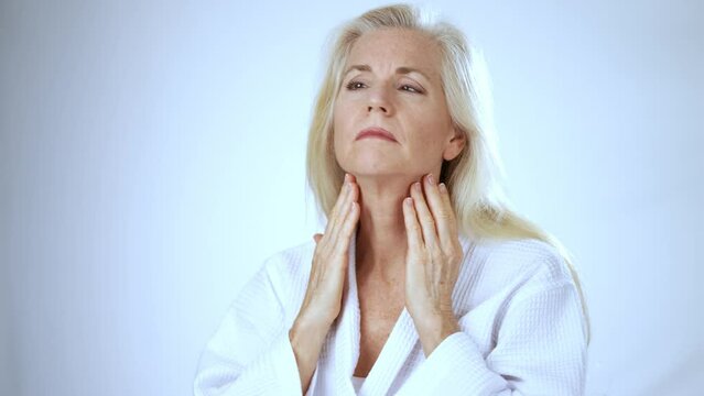 Beautiful mature old woman smiles wonder about face lift, cosmetic plastic surgery, healthy skin natural makeup skincare routine anti aging lifting wrinkles beauty self love