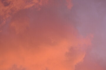 evening sunset, rays of the sun through cirrus pink clouds against the background of the sunset...