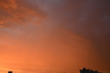 evening sunset, rays of the sun through cirrus pink clouds against the background of the sunset...