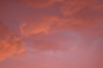 evening sunset, rays of the sun through cirrus pink clouds against the background of the sunset...