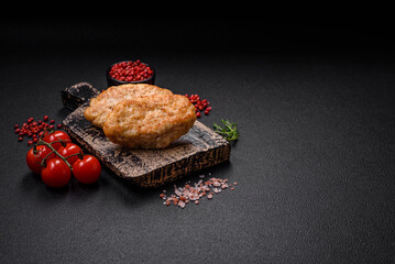 Delicious juicy cutlets or meatballs from minced chicken with salt and spices