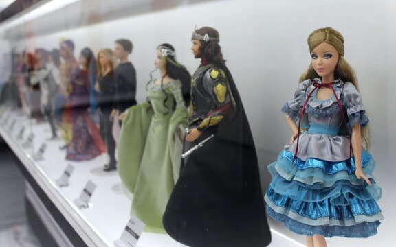 Beautiful Barbie dolls whose image is based on famous movie characters from successful films. Toys wear fashionable miniature gowns and being shown in Montreal at an expo.