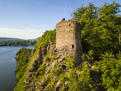 Aerial view of castle ruins Oheb. Romantic medieval ruins over lake Sec. Czech republic, European union.