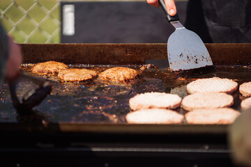 Flipping Burger Patties on a Flat Top Grill 2