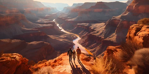 Foto op Plexiglas aerial view of a couple hiking on a winding trail through the Grand Canyon, dramatic shadows, deep orange and red hues of the rock formations © Marco Attano