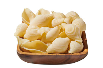Pasta conchigliei noodle in wooden bowl isolated on white, close up