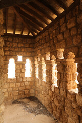 Inside room of abandoned castle with apparent stones 