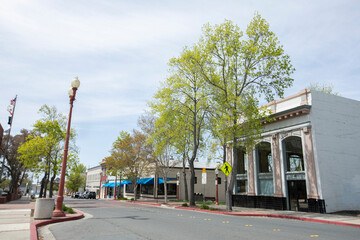 Afternoon sun shines on the historic buildings of downtown Antioch, California, USA.