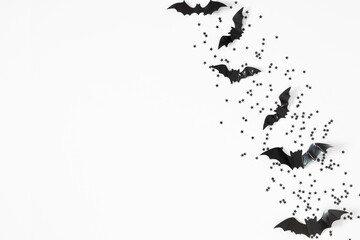 Halloween decorations concept. Black bats cut from paper on white background. Halloween decor and decorations for  holiday