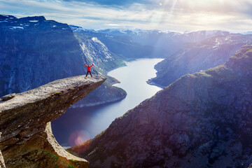 Woman jamping on Trolltunga in Norway  - 648315191