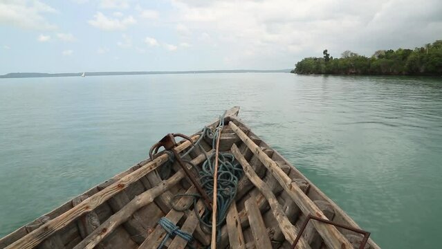 orbiting destroyed and broken wooden boat on Africa coast