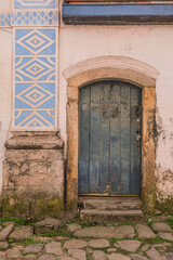 Street of historical center in Paraty, Rio de Janeiro, Brazil. Paraty is a preserved Portuguese colonial and Brazilian Imperial municipality. Old wood door.