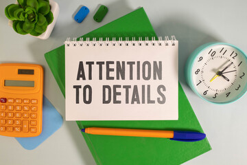 ATTENTION TO DETAILS text written on a notebook with chart