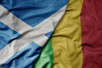 big waving national colorful flag of scotland and national flag of mali