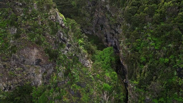 Aerial footage of Agua d'Alto waterfall is located in Faial 