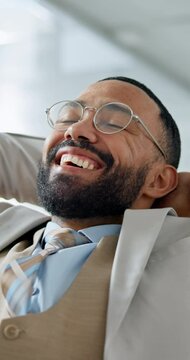 Relax, email and a happy businessman at work with success, promotion or complete with proposal. Smile, corporate and a young employee enjoying a break after online connection at an office job