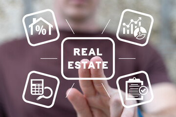 Real estate agent or client using virtual touch screen presses inscription: REAL ESTATE. Concept of real estate taxes, insurance, investment. Real estate market growth.