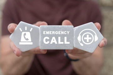 Man holding white foam blocks with icons and inscription: EMERGENCY CALL. Concept of emergency call...