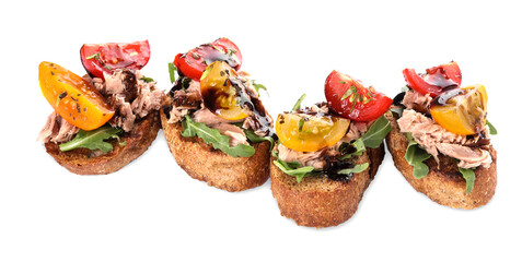 Delicious bruschettas with balsamic vinegar, tomatoes, arugula and tuna isolated on white