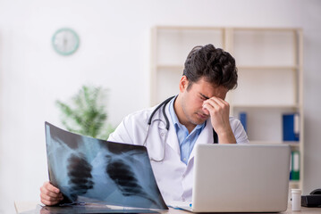 Young male doctor radiologist working in the clinic
