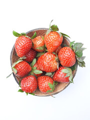 Bunch of strawberry put on the small bowl