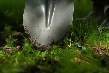 Farmer working in garden digging soil. Farming garden work.