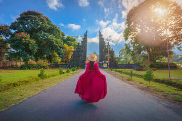 Young female tourist at the temple gate, Bali, Indonesia