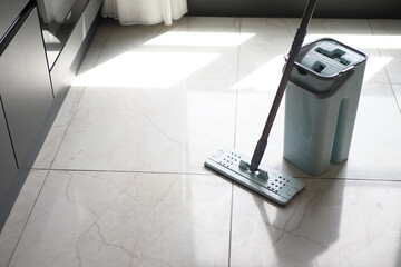 cleaning tiles floor with mop 