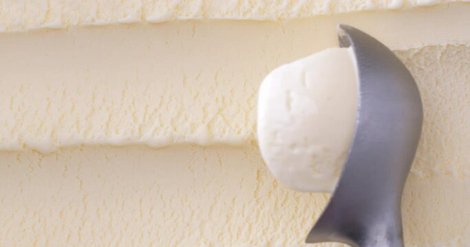 4K footage Close-up Top view,  Scoop out vanilla flavored ice cream view from above.