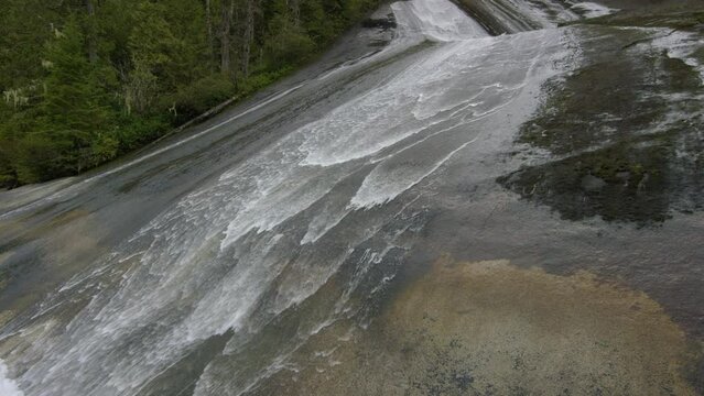 Water Rolling Down Rock Hill - Pan, slow motion