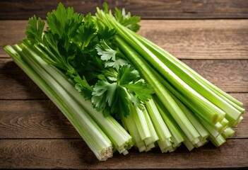 An image of fresh celery stalks on a wooden table.