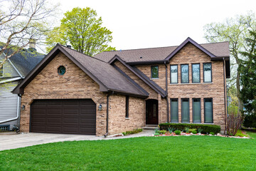 Obraz premium architecture residential house property in american suburban neighborhood with garage